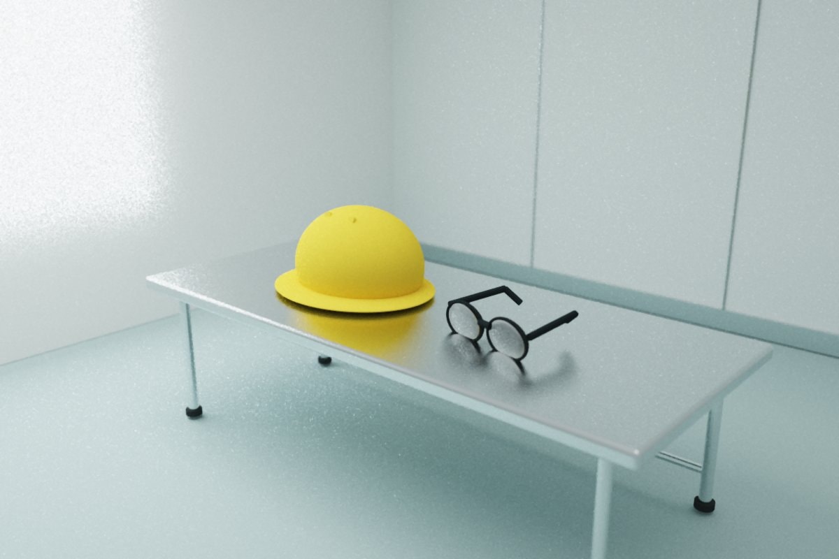 Yellow hard hat and clear safety glasses on a stainless surface