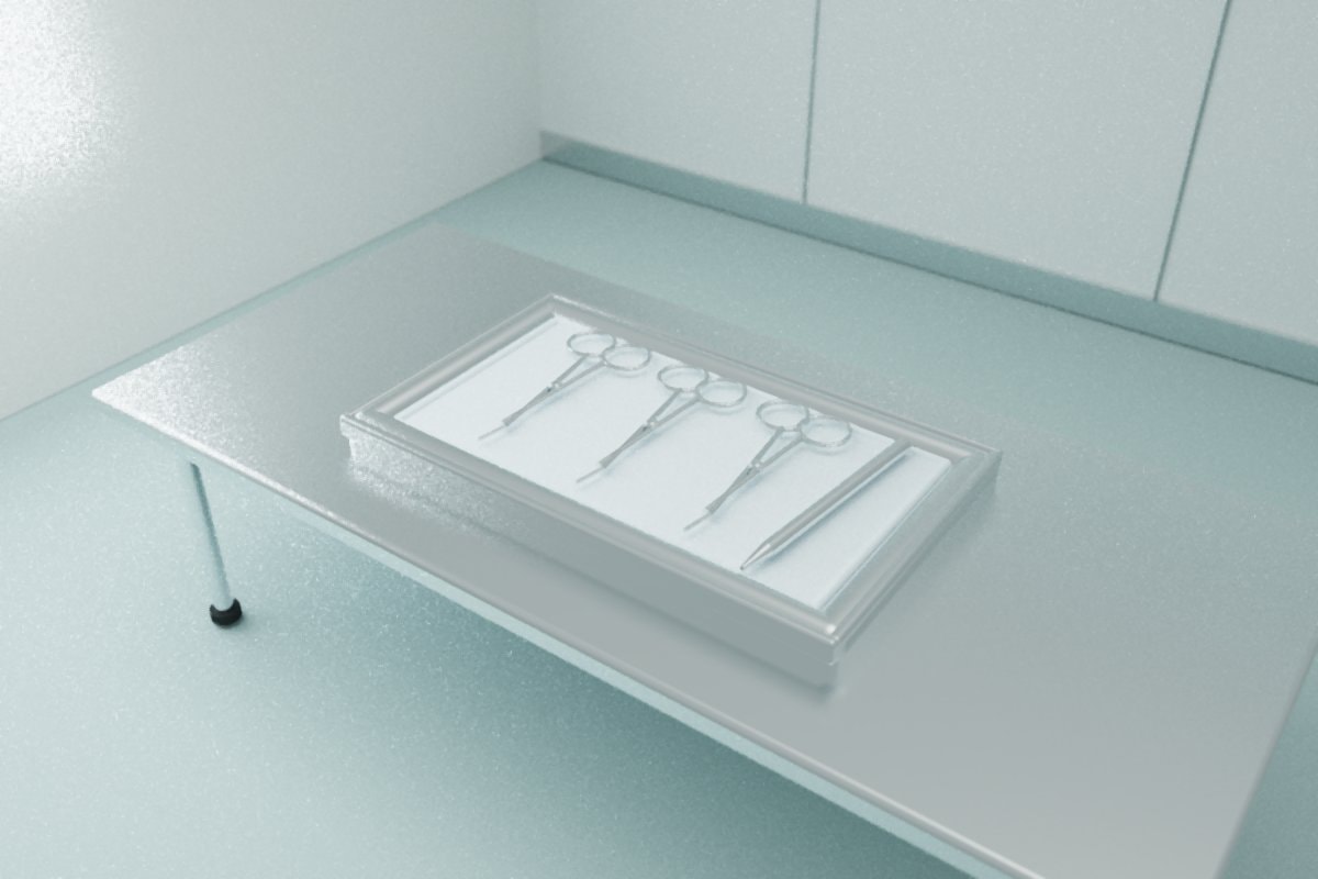 Plain metal instruments arranged on fabric inside a stainless tray